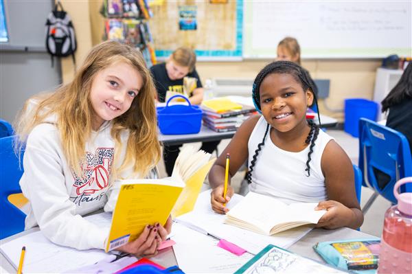 Students inside their classrooms learning. 